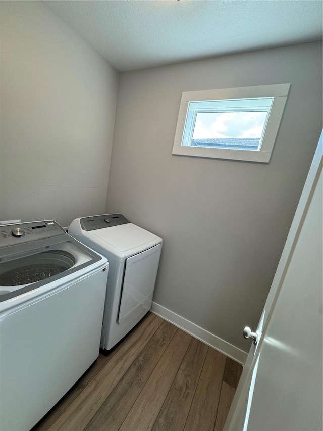 10009 Powell Ave, Johnston, IA 50131 - laundry area with separate washer and dryer and wood finished floors