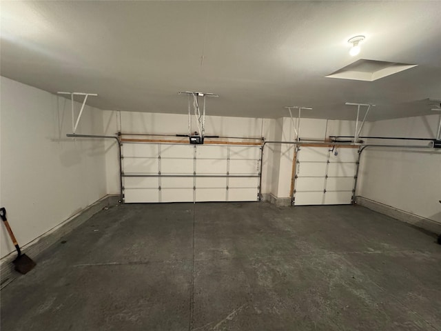 10009 Powell Ave, Johnston, IA 50131 - garage with baseboards and a garage door opener