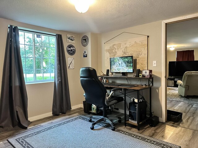 424 Hilltop Rd, Ames, IA 50014 - office featuring wood finished floors and a textured ceiling
