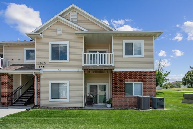 1815 SW White Birch Cir Unit 3, Ankeny, IA 50023 - back of house featuring a balcony, a lawn, brick siding, and stairs