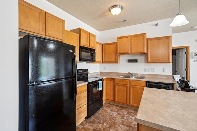 1815 SW White Birch Cir Unit 3, Ankeny, IA 50023 - kitchen with black appliances, light countertops, pendant lighting, a textured ceiling, and brown cabinets