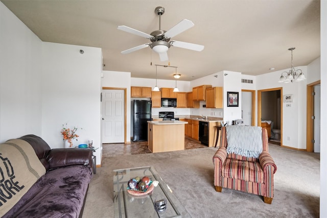 1815 SW White Birch Cir Unit 3, Ankeny, IA 50023 - living area featuring light colored carpet, a chandelier, and a ceiling fan