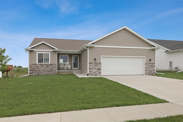 1819 8th Ave SE, Altoona, IA 50009 - view of front facade with driveway, a garage, a front yard, and stone siding