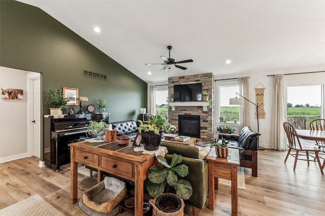 1819 8th Ave SE, Altoona, IA 50009 - living area with ceiling fan, light wood-style flooring, a fireplace, high vaulted ceiling, and recessed lighting
