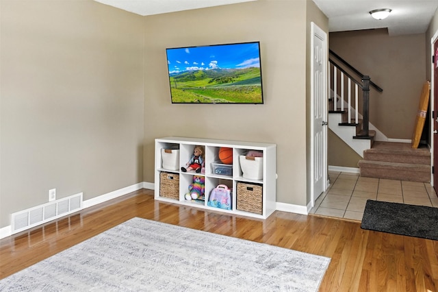 3832 Richmond Ave, Des Moines, IA 50317 - recreation room with wood finished floors and baseboards