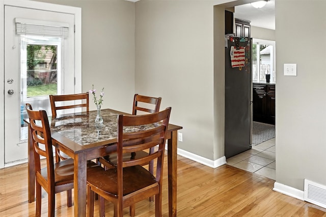 3832 Richmond Ave, Des Moines, IA 50317 - dining room with light wood-type flooring and baseboards