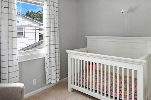 3832 Richmond Ave, Des Moines, IA 50317 - bedroom featuring carpet and a nursery area