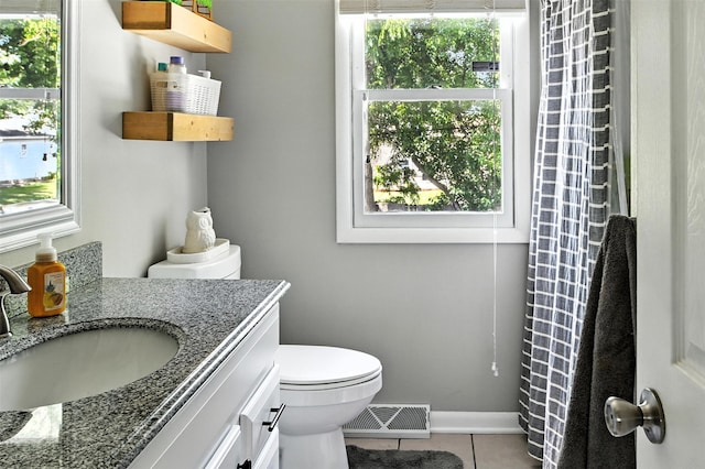 3832 Richmond Ave, Des Moines, IA 50317 - bathroom featuring vanity, tile patterned floors, and healthy amount of natural light
