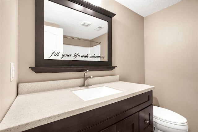 900 34th St SW, Bondurant, IA 50035 - bathroom featuring vanity and a textured ceiling