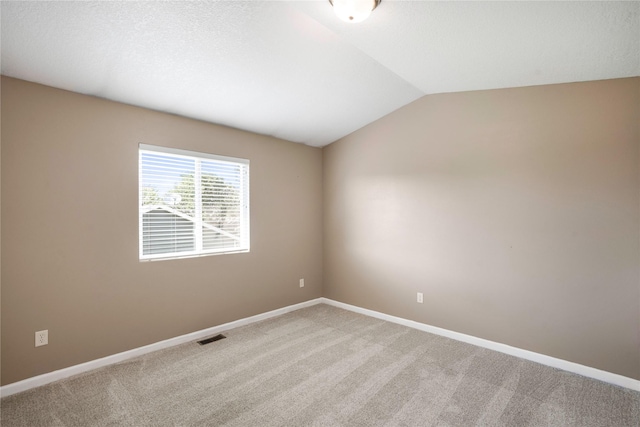 900 34th St SW, Bondurant, IA 50035 - unfurnished room featuring vaulted ceiling and light colored carpet