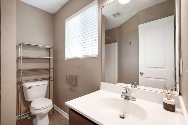 900 34th St SW, Bondurant, IA 50035 - bathroom featuring vanity and wood finished floors