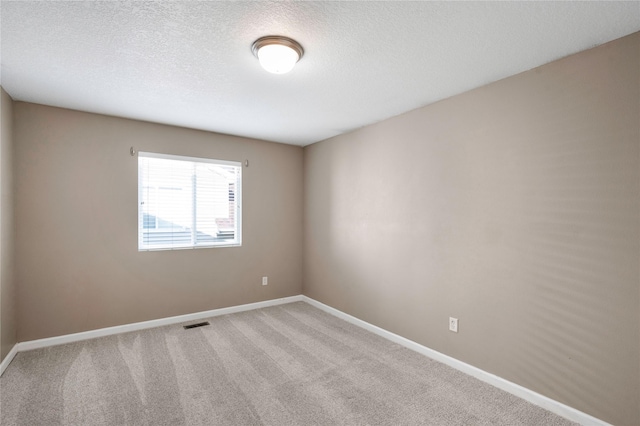 900 34th St SW, Bondurant, IA 50035 - empty room with carpet floors and a textured ceiling