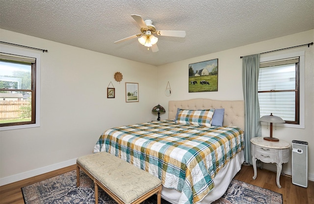 1506 S 14th St, Adel, IA 50003 - bedroom with wood finished floors, a textured ceiling, and ceiling fan
