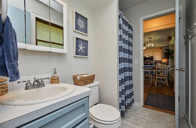 1506 S 14th St, Adel, IA 50003 - full bathroom with vanity, marble finish floors, curtained shower, and a textured ceiling