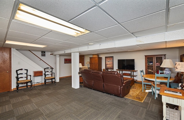 1506 S 14th St, Adel, IA 50003 - living area featuring dark carpet, a drop ceiling, and stairway