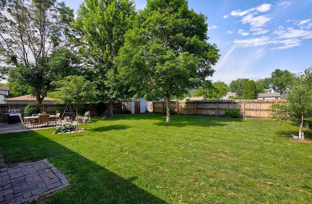 1506 S 14th St, Adel, IA 50003 - fenced backyard featuring a storage unit and a patio area