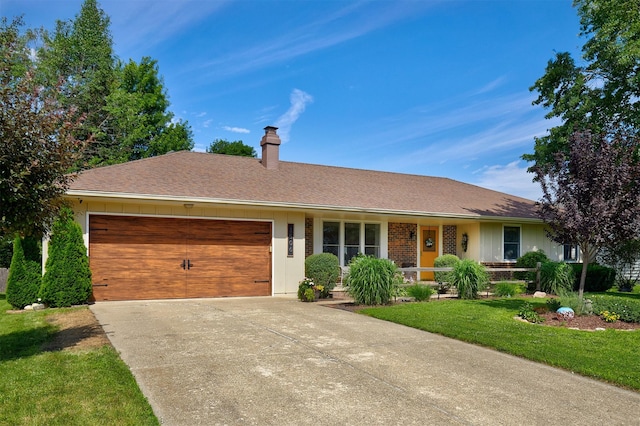 1506 S 14th St, Adel, IA 50003 - single story home featuring an attached garage, a chimney, concrete driveway, a front lawn, and a porch