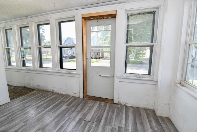 603 W Church St, Marshalltown, IA 50158 - unfurnished sunroom featuring plenty of natural light and wood finished floors