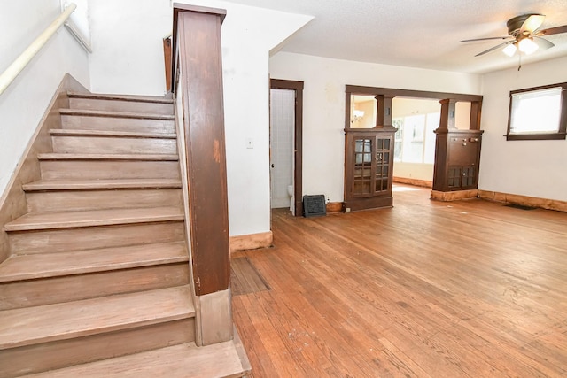603 W Church St, Marshalltown, IA 50158 - stairway with a ceiling fan and wood-type flooring