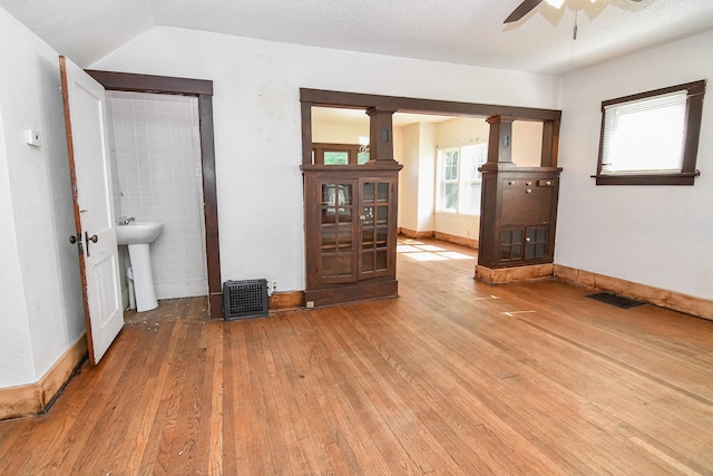 603 W Church St, Marshalltown, IA 50158 - empty room featuring ceiling fan and hardwood / wood-style floors