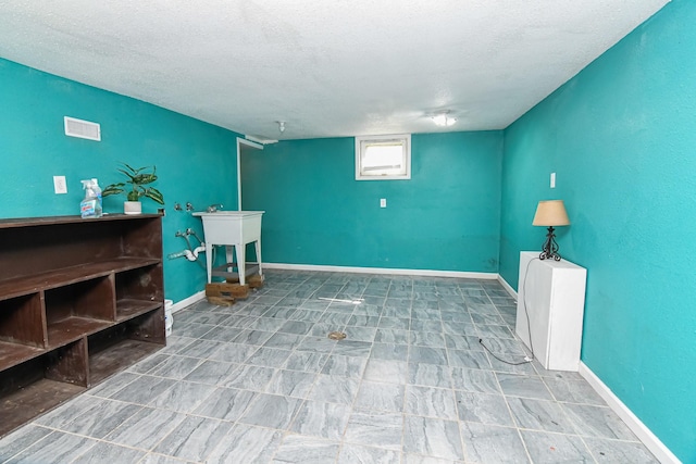 603 W Church St, Marshalltown, IA 50158 - basement with a textured ceiling
