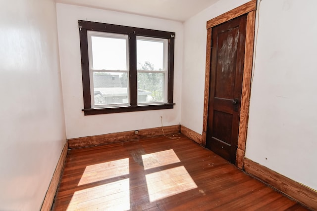 603 W Church St, Marshalltown, IA 50158 - unfurnished room with wood finished floors and baseboards