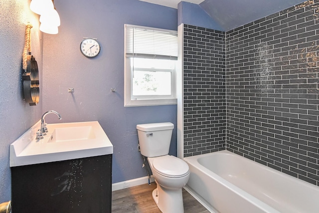 603 W Church St, Marshalltown, IA 50158 - full bath featuring wood finished floors, vanity, and shower / washtub combination