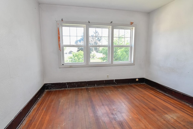 603 W Church St, Marshalltown, IA 50158 - unfurnished room featuring wood-type flooring and baseboards