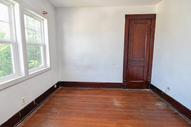 603 W Church St, Marshalltown, IA 50158 - unfurnished room featuring healthy amount of natural light and wood-type flooring