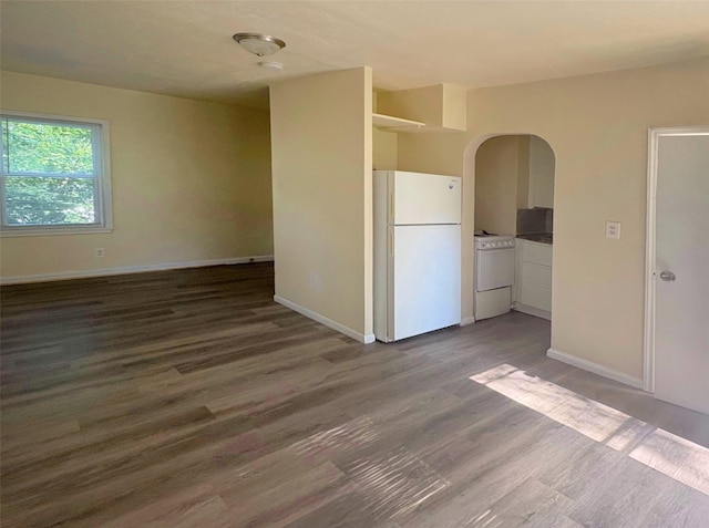 2826 Oxford St, Des Moines, IA 50313 - unfurnished room featuring wood finished floors and arched walkways
