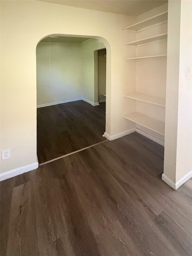 2826 Oxford St, Des Moines, IA 50313 - unfurnished room featuring arched walkways and wood finished floors
