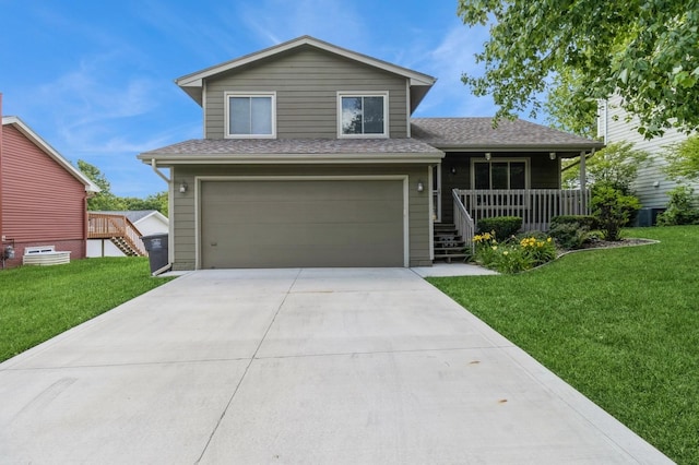 3612 SE 18th Ct, Des Moines, IA 50320 - view of front of house with an attached garage, a front yard, concrete driveway, a porch, and stairway