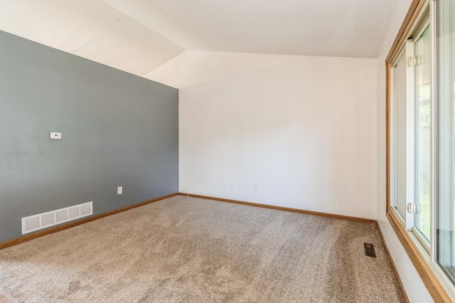 3612 SE 18th Ct, Des Moines, IA 50320 - empty room with lofted ceiling, healthy amount of natural light, and carpet