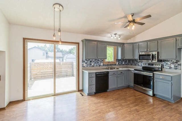 3612 SE 18th Ct, Des Moines, IA 50320 - kitchen with appliances with stainless steel finishes, gray cabinets, decorative backsplash, light countertops, and ceiling fan