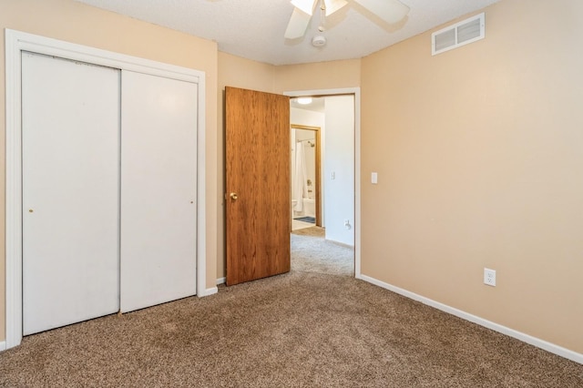 3612 SE 18th Ct, Des Moines, IA 50320 - unfurnished bedroom with carpet flooring, a closet, and ceiling fan