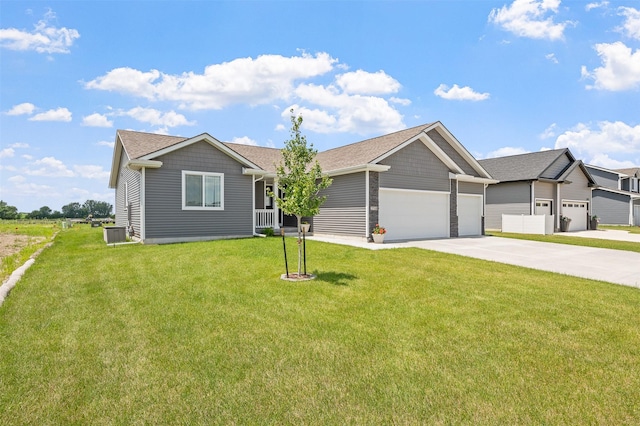 2708 NW Boulder Point Pl, Ankeny, IA 50023 - view of front of house featuring an attached garage, concrete driveway, a front lawn, and roof with shingles