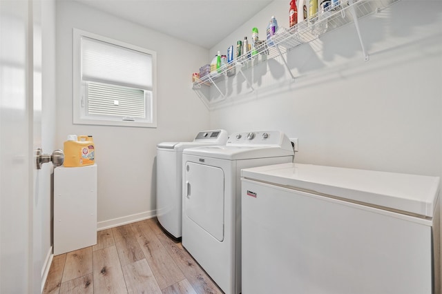 2708 NW Boulder Point Pl, Ankeny, IA 50023 - laundry area with washing machine and dryer and light wood-style floors