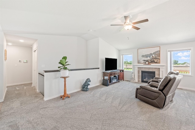2708 NW Boulder Point Pl, Ankeny, IA 50023 - living area featuring a fireplace, carpet flooring, ceiling fan, and vaulted ceiling