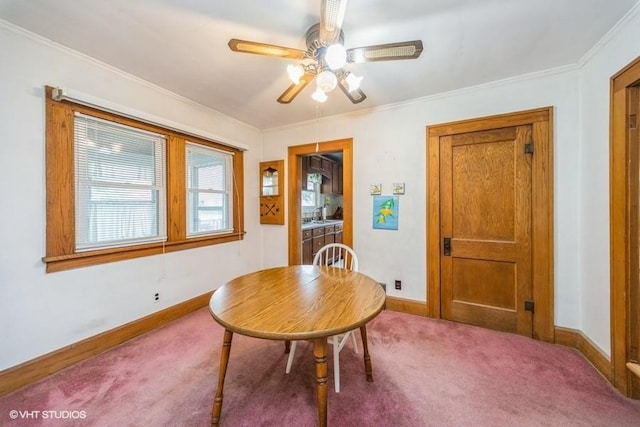 3617 E 8th St, Des Moines, IA 50316 - carpeted dining area featuring a ceiling fan and crown molding