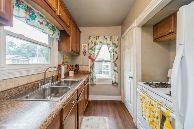 3617 E 8th St, Des Moines, IA 50316 - kitchen featuring white appliances, brown cabinets, and dark wood-style flooring