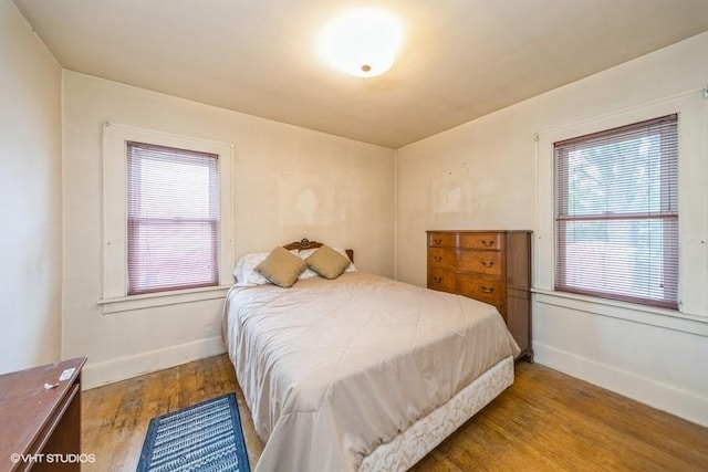 3617 E 8th St, Des Moines, IA 50316 - bedroom featuring wood finished floors and baseboards