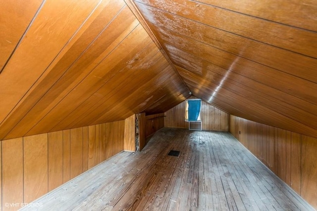 3617 E 8th St, Des Moines, IA 50316 - bonus room with wood walls, dark wood finished floors, lofted ceiling, and wood ceiling
