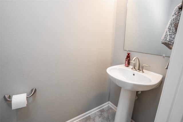 303 SE 14th St, Grimes, IA 50111 - bathroom with baseboards and a sink