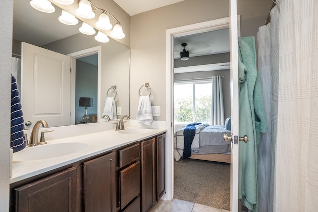 303 SE 14th St, Grimes, IA 50111 - full bathroom with ensuite bathroom, double vanity, tile patterned flooring, and ceiling fan