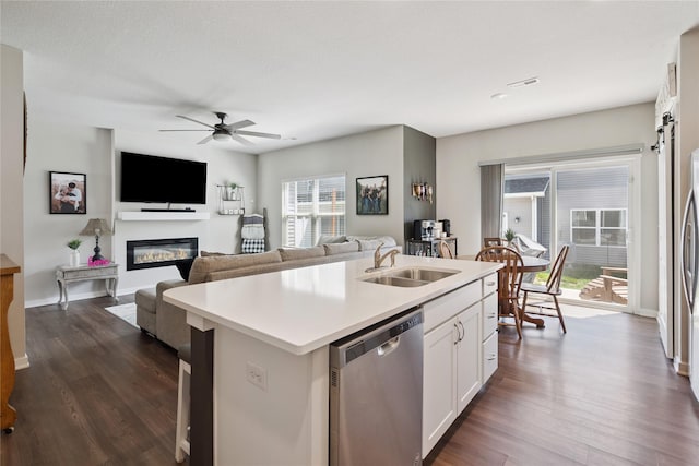 3213 NW Linwood Ln, Ankeny, IA 50023 - kitchen featuring dishwasher, light countertops, dark wood finished floors, a center island with sink, and recessed lighting