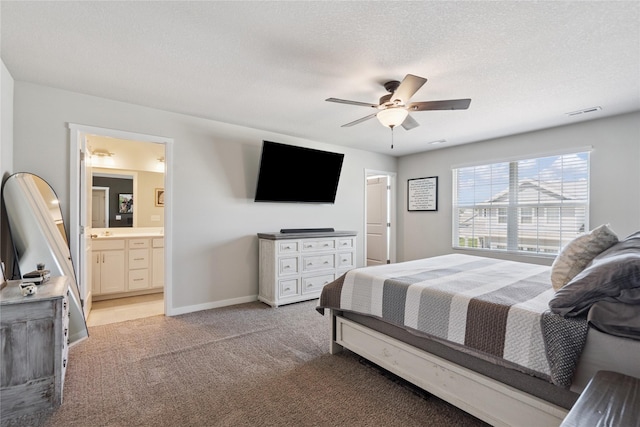 3213 NW Linwood Ln, Ankeny, IA 50023 - bedroom featuring light colored carpet, ceiling fan, ensuite bathroom, and a textured ceiling