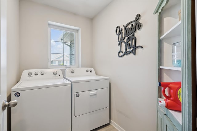 3213 NW Linwood Ln, Ankeny, IA 50023 - washroom featuring washing machine and dryer and baseboards