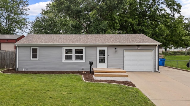 503 S Freeman St, Indianola, IA 50125 - ranch-style house with concrete driveway, a garage, and roof with shingles