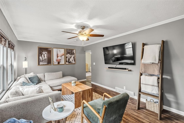 503 S Freeman St, Indianola, IA 50125 - living area featuring wood finished floors, a ceiling fan, ornamental molding, and a textured ceiling