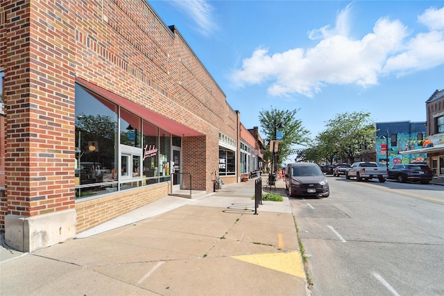 3935 8th St, Des Moines, IA 50313 - view of asphalt road featuring sidewalks, curbs, and street lighting